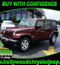 jeep wrangler unlimited 2007 red suv sahara gasoline 6 cylinders rear wheel drive automatic 33021