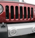 jeep wrangler unlimited 2010 red suv sahara gasoline 6 cylinders 4 wheel drive manual 45324