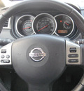 nissan versa 2011 black hatchback sl gasoline 4 cylinders front wheel drive automatic 33884