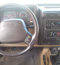 jeep wrangler 2002 green suv sahara gasoline 6 cylinders 4 wheel drive 5 speed manual 33884