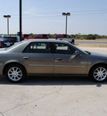 cadillac dts 2011 green sedan gasoline 8 cylinders front wheel drive automatic 76087