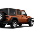 jeep wrangler unlimited 2011 orange suv sport gasoline 6 cylinders 4 wheel drive automatic 33021