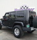 jeep wrangler 2010 black clearcoat suv unlimited sahara gasoline 6 cylinders 4 wheel drive automatic 80905