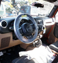 jeep wrangler unlimited 2011 orange suv sahara gasoline 6 cylinders 4 wheel drive 6 speed manual 08844