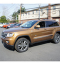 jeep grand cherokee 2011 brown suv 70th anniversary gasoline 8 cylinders 4 wheel drive automatic with overdrive 08844