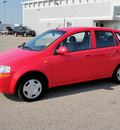 chevrolet aveo 2004 red hatchback 1 6 gasoline 4 cylinders front wheel drive 5 speed manual 56001