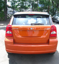 dodge caliber 2011 orange hatchback mainstreet gasoline 4 cylinders front wheel drive automatic 80301