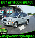 hyundai tucson 2009 silver suv gls gasoline 4 cylinders front wheel drive automatic 33021