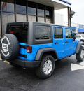 jeep wrangler unlimited 2011 pb4 cosmo blue suv gasoline 6 cylinders 4 wheel drive automatic 33021