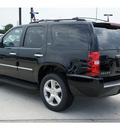 chevrolet tahoe 2011 black suv ltz flex fuel 8 cylinders 2 wheel drive automatic with overdrive 77090
