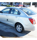 chevrolet sonic 2012 silver sedan ls gasoline 4 cylinders front wheel drive 6 speed manual 77090