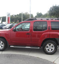 nissan xterra 2010 red suv gasoline 6 cylinders 2 wheel drive automatic 33884