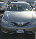 toyota camry 2006 green sedan gasoline 4 cylinders front wheel drive automatic with overdrive 13502