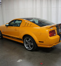 ford mustang 2009 orange coupe gt premium gasoline 8 cylinders rear wheel drive 5 speed manual 76108