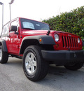 jeep wrangler 2012 red suv sport gasoline 6 cylinders 4 wheel drive 6 speed manual 33157