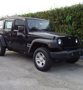 jeep wrangler unlimited 2012 black suv sport gasoline 6 cylinders 4 wheel drive 6 speed manual 33157