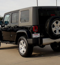 jeep wrangler unlimited 2010 black suv sahara gasoline 6 cylinders 4 wheel drive 6 speed manual 62034