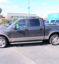 ford f 150 2005 brown lariat gasoline 8 cylinders rear wheel drive automatic with overdrive 32401