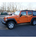 jeep wrangler unlimited 2012 orange suv sport gasoline 6 cylinders 4 wheel drive 6 speed manual 08844