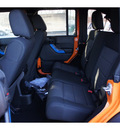 jeep wrangler unlimited 2012 orange suv sport gasoline 6 cylinders 4 wheel drive 6 speed manual 08844