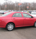 toyota corolla 2009 red sedan le gasoline 4 cylinders front wheel drive automatic 56001