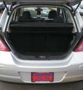 nissan versa 2009 silver hatchback gasoline 4 cylinders front wheel drive 6 speed manual 13502