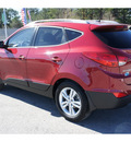 hyundai tucson 2011 dk  red gls gasoline 4 cylinders front wheel drive automatic 77388