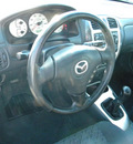 mazda protege5 2003 black hatchback gasoline 4 cylinders dohc front wheel drive 5 speed with overdrive 92882