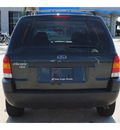 ford escape 2003 green suv xls value gasoline 6 cylinders dohc front wheel drive automatic 77065