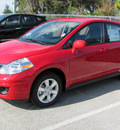 nissan versa 2012 red hatchback s gasoline 4 cylinders front wheel drive automatic 33884