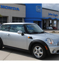 mini cooper 2009 silver hatchback gasoline 4 cylinders front wheel drive 6 speed manual 77065