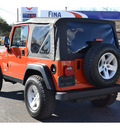 jeep wrangler 2005 orange suv rubicon gasoline 6 cylinders 4 wheel drive 6 speed manual 76903