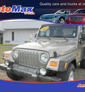 jeep wrangler 2004 gold suv rubicon gasoline 6 cylinders 4 wheel drive 5 speed manual 34474