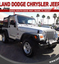 jeep wrangler 2004 silver suv sport gasoline 6 cylinders 4 wheel drive automatic 33157