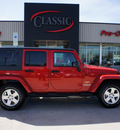 jeep wrangler unlimited 2011 red suv sahara gasoline 6 cylinders 4 wheel drive automatic 76210