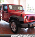 jeep wrangler unlimited 2009 red suv x gasoline 6 cylinders 2 wheel drive automatic 33912