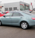toyota camry 2009 green sedan le gasoline 4 cylinders front wheel drive automatic 56001