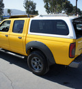 nissan frontier 2002 yellow xe v6 gasoline 6 cylinders rear wheel drive 5 speed with overdrive 92882
