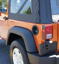 jeep wrangler 2011 orange suv sport gasoline 6 cylinders 4 wheel drive 6 speed manual 33021