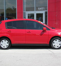 nissan versa 2009 red hatchback gasoline 4 cylinders front wheel drive automatic 33884