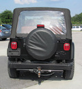 jeep wrangler 2002 black suv gasoline 6 cylinders 4 wheel drive standard 33884