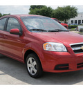 chevrolet aveo 2011 red sedan lt gasoline 4 cylinders front wheel drive automatic 77090