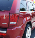 jeep grand cherokee 2010 red suv srt8 gasoline 8 cylinders 4 wheel drive automatic 33021