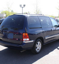 ford windstar 2002 blue van se gasoline 6 cylinders front wheel drive automatic with overdrive 80229