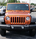 jeep wrangler 2011 orange suv sport gasoline 6 cylinders 4 wheel drive 6 speed manual 61832