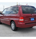 kia sedona 2005 red van lx gasoline 6 cylinders front wheel drive automatic 77037