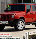 jeep wrangler unlimited 2009 orange suv sahara gasoline 6 cylinders 4 wheel drive automatic 62034