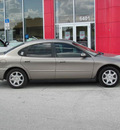 ford taurus 2006 gold sedan sel gasoline 6 cylinders front wheel drive automatic 33884
