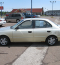 hyundai accent 2002 tan sedan gl gasoline 4 cylinders front wheel drive automatic with overdrive 55811