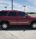 gmc yukon 2005 red suv gasoline 8 cylinders rear wheel drive automatic 76087